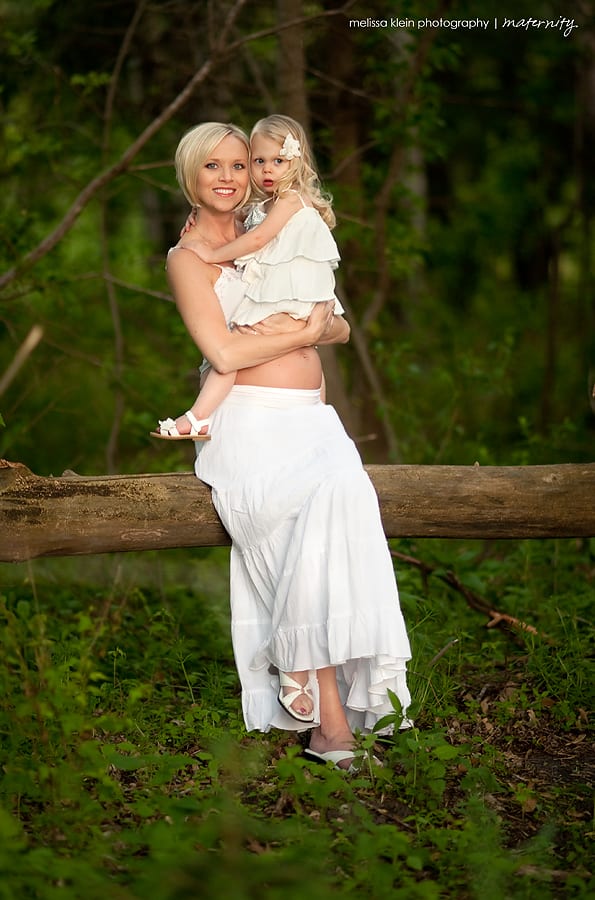 maternity photo in white gown in woods