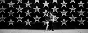 photo of couple by wall of stars at First Ave in Mpls