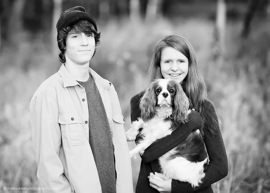siblings with dog