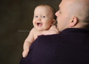 smiling baby with his dad