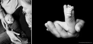 newborn feet in dads hands black and white
