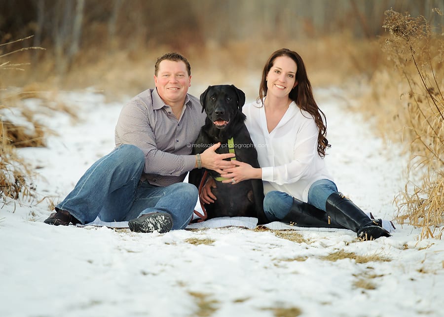 family photo with black lab dog