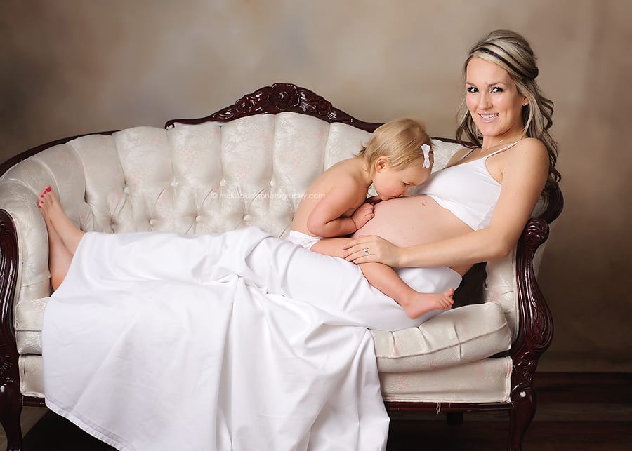 maternity photo with vintage settee