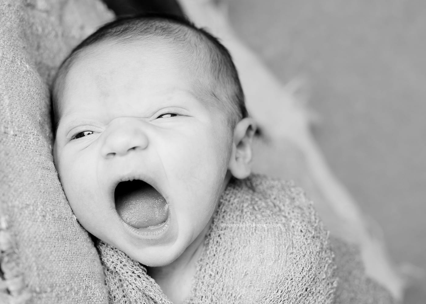 yawing newborn baby