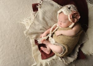 newborn girl with knit hat