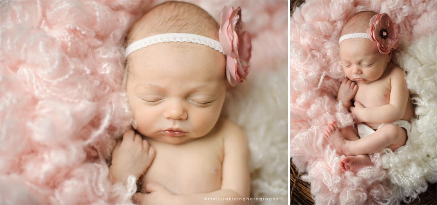 newborn girl on soft pink with flower