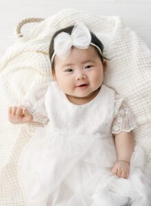 100 day session of baby girl in white dress