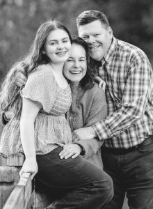 black and white photo outdoor with parents and teenage girl