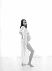 backlit studio pregnancy photos in lace robe
