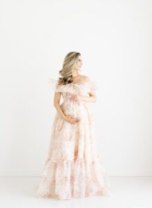 pregnant mom in floral dress from Anthropologie