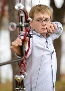 senior photos with bow and arrow