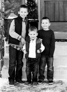 three brothers on stairs black and white