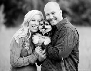 Black and white photo of couple with dog