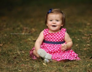1 year old girl in pink polka dot dress