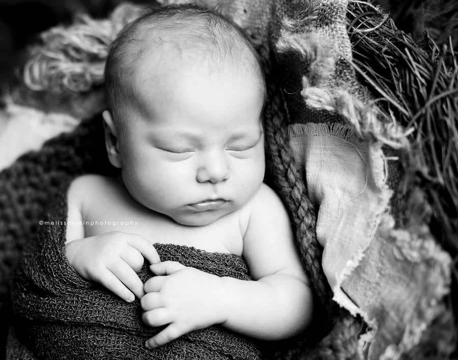 black and white swaddled newborn photo