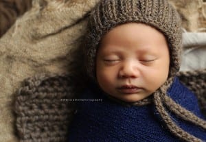 newborn baby with knit hat