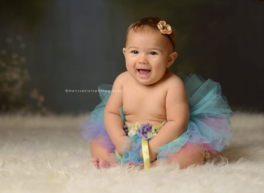 smiling baby girl in tutu