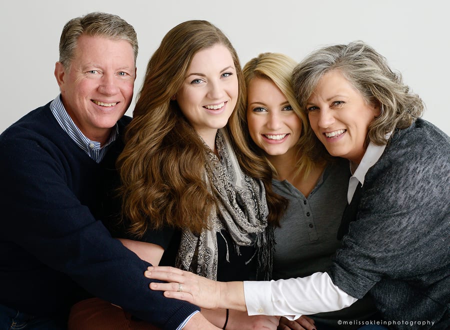 Minneapolis family photographer with family of four in studio