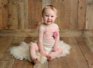 Baby photos with wood wall