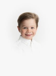 heirloom photo in color with toddler boy and white vignette background