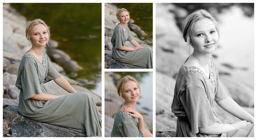 Senior photos of girl in blue dress sitting on rocks by the lake