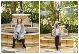photo of girl sitting by fountain in the Minnesota zoo conservatory