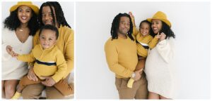 family photos with pregnant mom, dad and toddler son in against a white wall in a natural light photography studio.