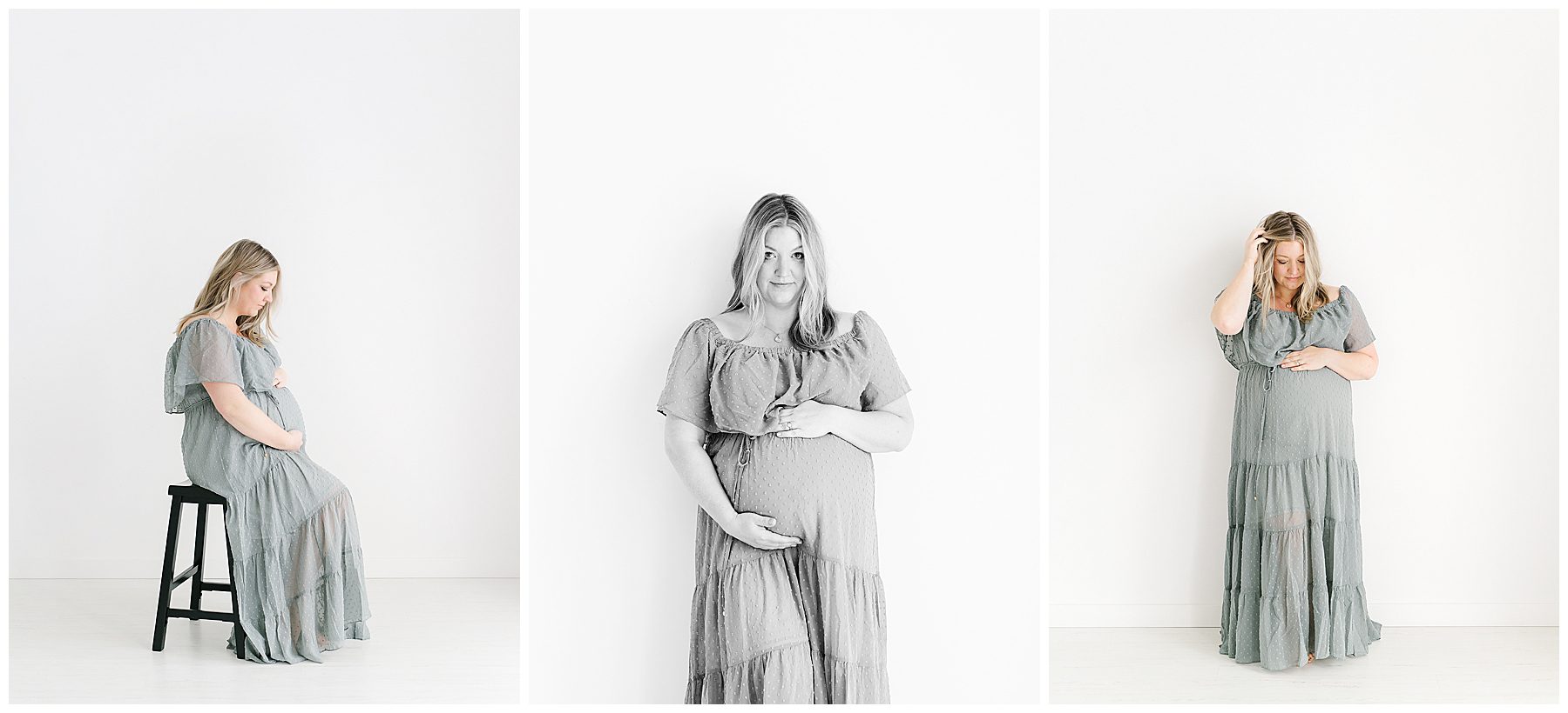 Maternity photos near Hugo with mom in long blue dress against a white wall