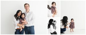 Family photos with one year old baby girl with white wall in natural light photography studio.