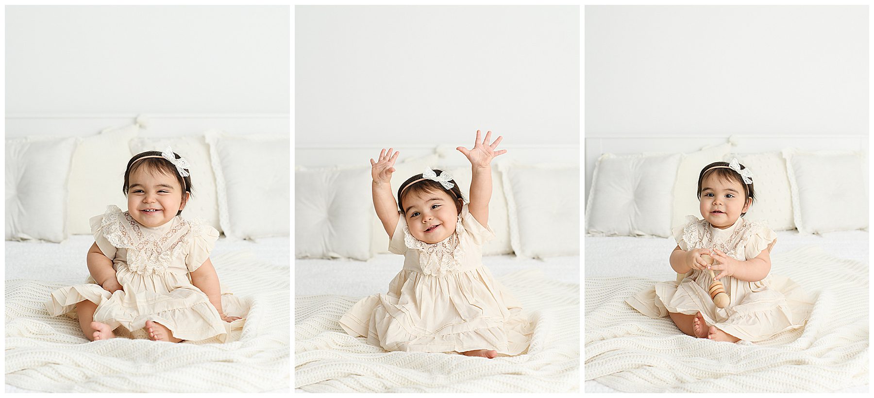 Studio session for one year old baby in white dress on bed