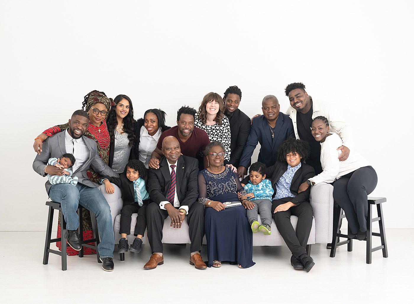 extended family photos with a group of 16 on white backdrop