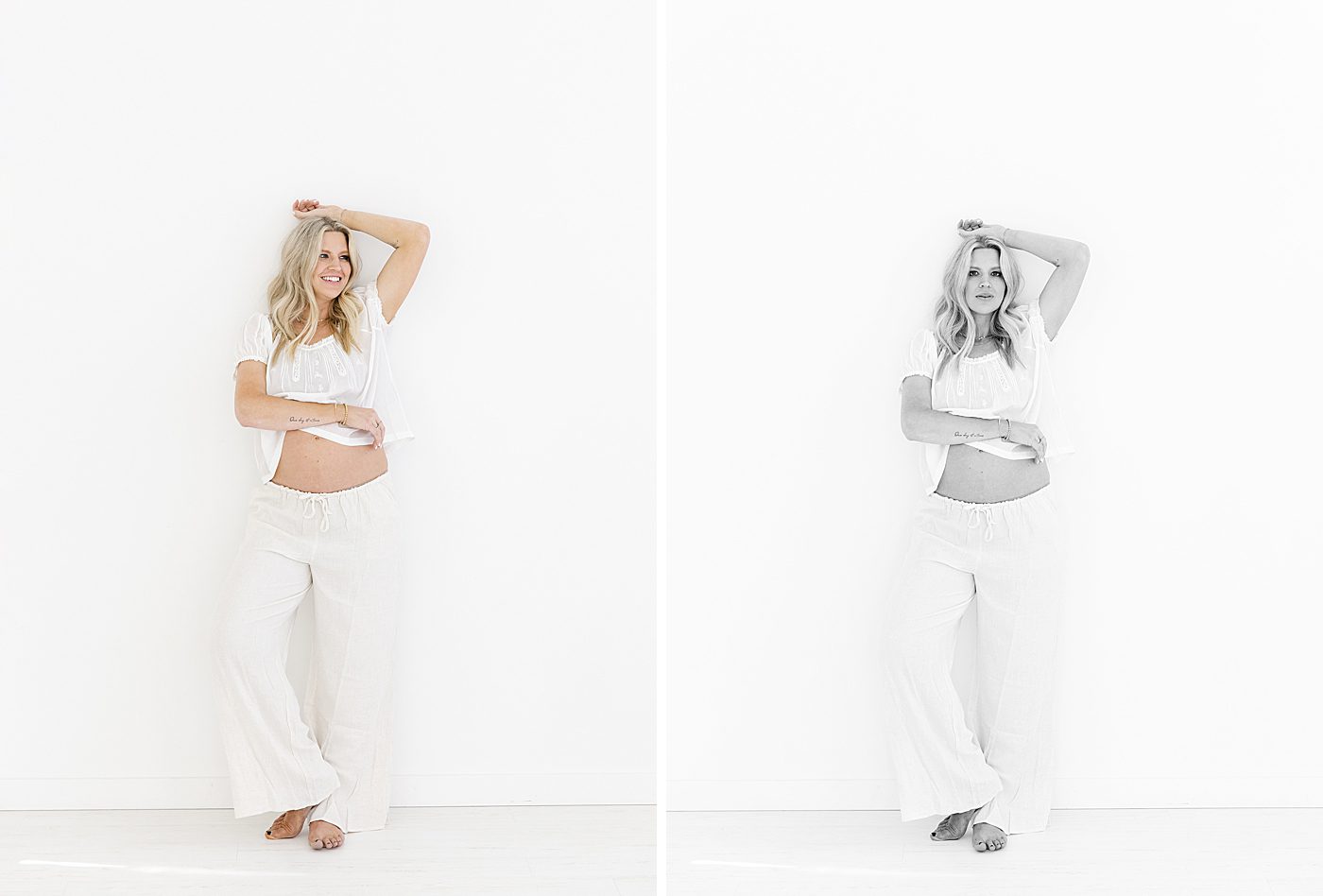 Pregnant mom in white Doen Frederica top and linen pants poses for studio maternity photos against a white wall