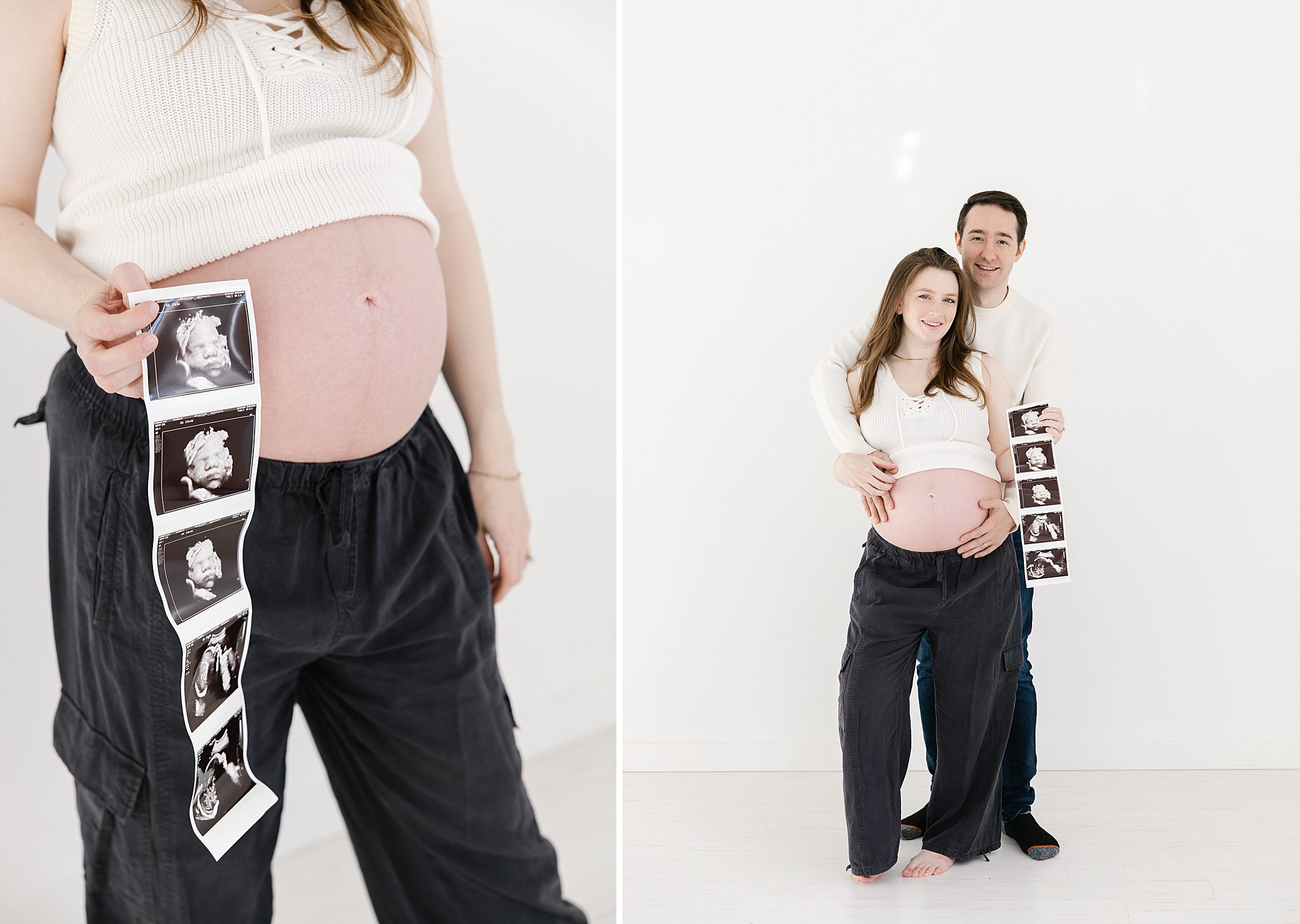 couple holding ultrasound photos