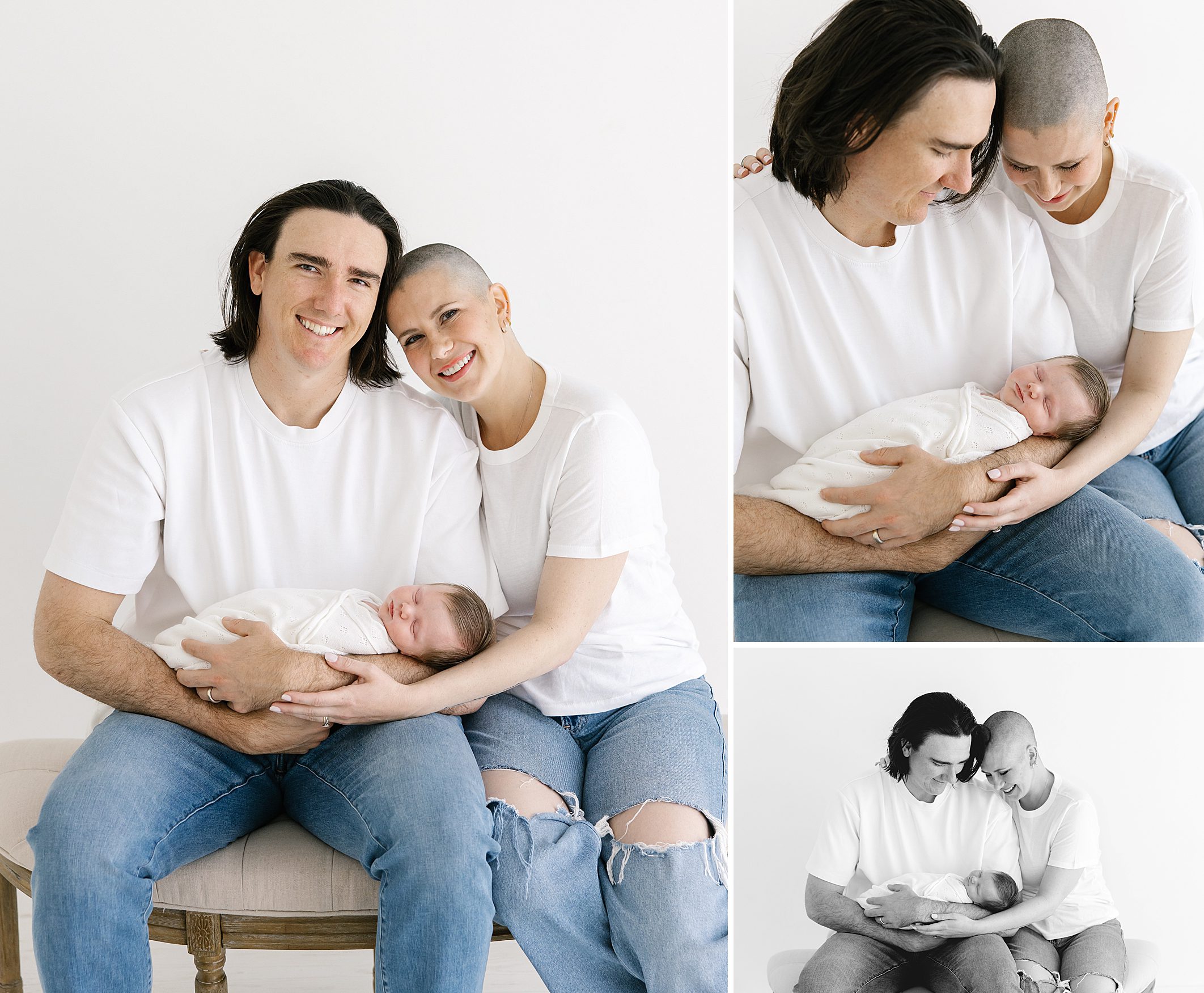Mom and dad in white t-shirt an jeans holding their newborn baby girl